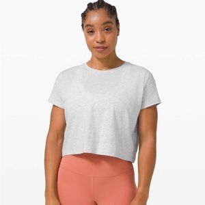 Two (2) Lululemon cates tees one in black and the other on heather grey